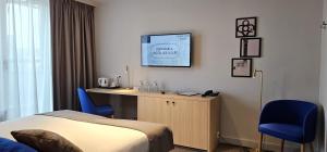 Voodi või voodid majutusasutuse Hotel Les 3 Cles toas