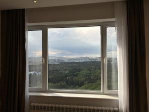 a window in a room with a view at Four View Apartments Baku in Baku