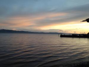a view of a body of water at sunset at Haus Weyers in Kressbronn am Bodensee