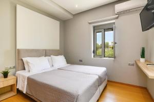 Ένα ή περισσότερα κρεβάτια σε δωμάτιο στο Villa Costa by Villa Plus +14 φωτογραφίες