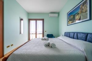 Кровать или кровати в номере Villa Rosa sul mare