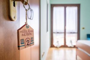 Кровать или кровати в номере Villa Rosa sul mare