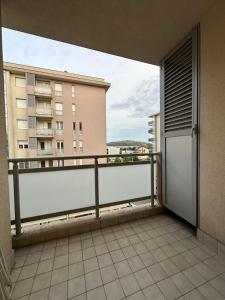 a balcony with a view of a building at District Loft in Podgorica