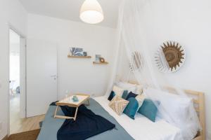 Posteľ alebo postele v izbe v ubytovaní Casa un Tocco di Blu con piscina privata