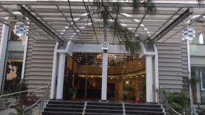 a lobby of a building with stairs in front at The Legend in Allahābād