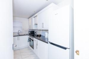Kuchyň nebo kuchyňský kout v ubytování First Class Flat