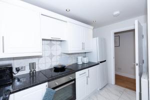 Kuchyň nebo kuchyňský kout v ubytování First Class Flat