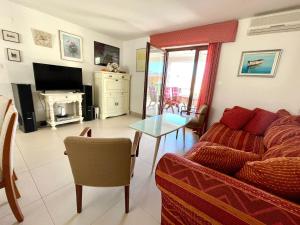 a living room with a couch and a table at Vacation Villa Brac in Splitska