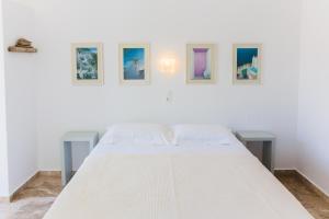 Postel nebo postele na pokoji v ubytování Roses Beach