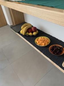 a tray of fruit and vegetables on a shelf at Solus b&b in Casteldaccia +23 photos