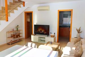 TV a/nebo společenská místnost v ubytování Haus Almassora playa Strandnähe