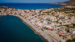 an aerial view of a town on the beach at EYTYXHS Studios in Palaiochora