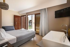 Postel nebo postele na pokoji v ubytování La Palma Beachfront Suites