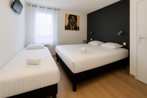 Postel nebo postele na pokoji v ubytování Fasthôtel Limoges Nord - FH Confort