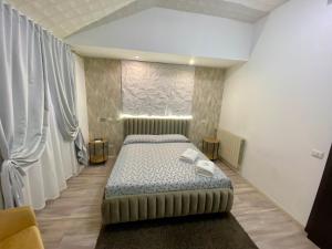 A bed or beds in a room at Guest House Minas