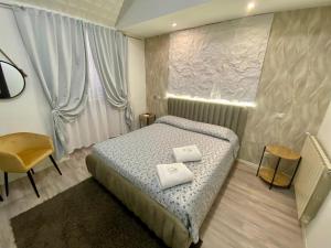 A bed or beds in a room at Guest House Minas