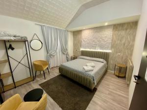 A bed or beds in a room at Guest House Minas