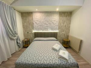 A bed or beds in a room at Guest House Minas