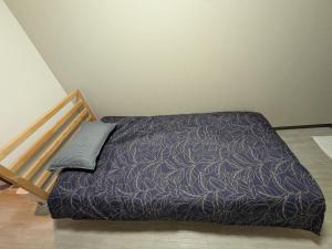 Postel nebo postele na pokoji v ubytování 長橋屋
