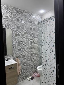 a bathroom with a shower and a toilet and a sink at CHU Tanger in Tangier