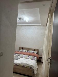 a bedroom with a bed in a small room at CHU Tanger in Tangier