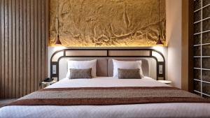 Katil atau katil-katil dalam bilik di Rempart Hotel
