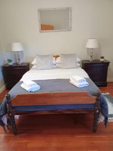 a bed with two towels on top of it at Karoorus Mossie -Loxton Overnight Stay in Loxton