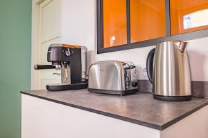 Cuisine ou kitchenette dans l'établissement Les suites du castillet