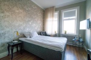 Letto o letti in una camera di Grand Hotel Jonkoping, BW Signature Collection