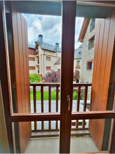 a view from the window of a balcony at Apartamento Punta Escarra in Escarrilla +33 photos