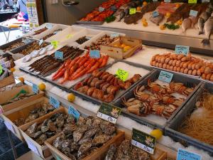 a market with many different types of vegetables on display at L'écluse appartement vue sur mer in Port-en-Bessin-Huppain +2 photos