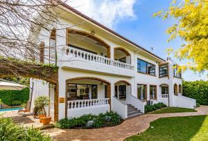 an image of a house with a pool at 5 Rembrandt Guesthouse in Somerset West