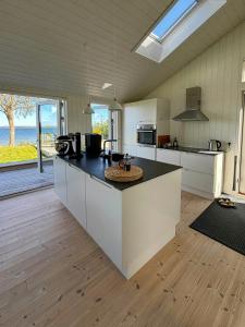 a kitchen with a counter top in a room at Holiday Home With Fjord Views At Tuse Næs in Holbæk