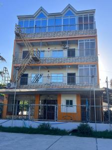 an apartment building with a fire escape on it at DC Travellers Inn in Malolos