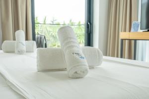 a group of rolled up towels on a table at Manta Hotel in Ksamil +132 photos