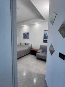 a living room with a bed and a couch at B&B a casa di Sonia in Termoli