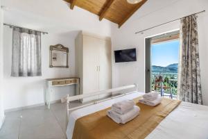 Ένα ή περισσότερα κρεβάτια σε δωμάτιο στο Villa Nefeli Lefkas +26 φωτογραφίες
