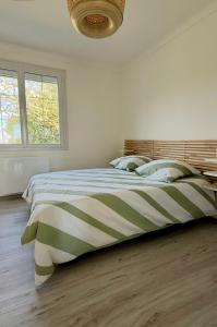 Postel nebo postele na pokoji v ubytování L'échappée