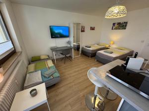 En eller flere senge i et værelse på Altstadtoase an der Marientormauer + 27 billeder