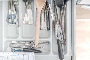 a drawer filled with utensils in a refrigerator at Fontanières Charming studio on the edge of Lyon in La Mulatière