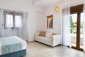 Voodi või voodid majutusasutuse Bergamot & Myrtillo Villas with shared pool,Afitos #FeelsLikeHome toas