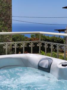 a swimming pool with a water slide at Villa Odelia in Neokhórion