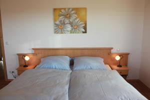 Postel nebo postele na pokoji v ubytování Urlaubshof Grimm + 2 fotografie