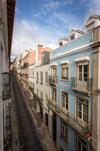 a view of an alley of buildings in a city at 54 Santa Catarina Apartments in Lisbon