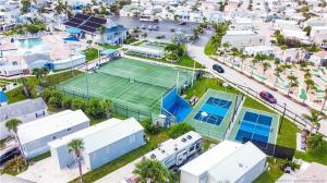 an aerial view of a tennis court in a city at Intracoastal Breezes N1173 in Jensen Beach
