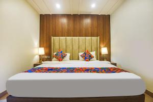 Ένα ή περισσότερα κρεβάτια σε δωμάτιο στο FabHotel Prime PAS Resorts - A Lake View Hotel +31 φωτογραφίες