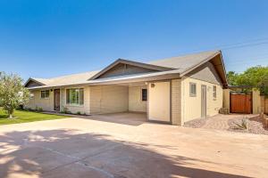 a house with a driveway in front of it at 3 Mi to Dtwn Shops and Eats Mesa Home with Pool! in Mesa
