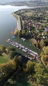 an aerial view of a marina with boats in the water at Laguna Beskidów Resort - Apartament Miętowy in Zarzecze