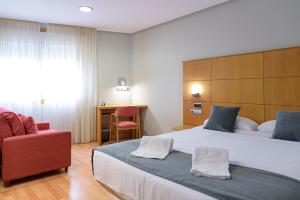 Postel nebo postele na pokoji v ubytování Hotel Alda Xinzo