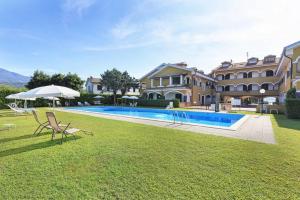 a villa with a swimming pool and a house at Lake's dream in Feriolo